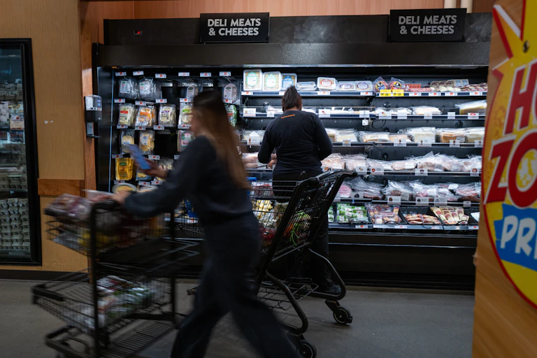 People shop at a grocery store.