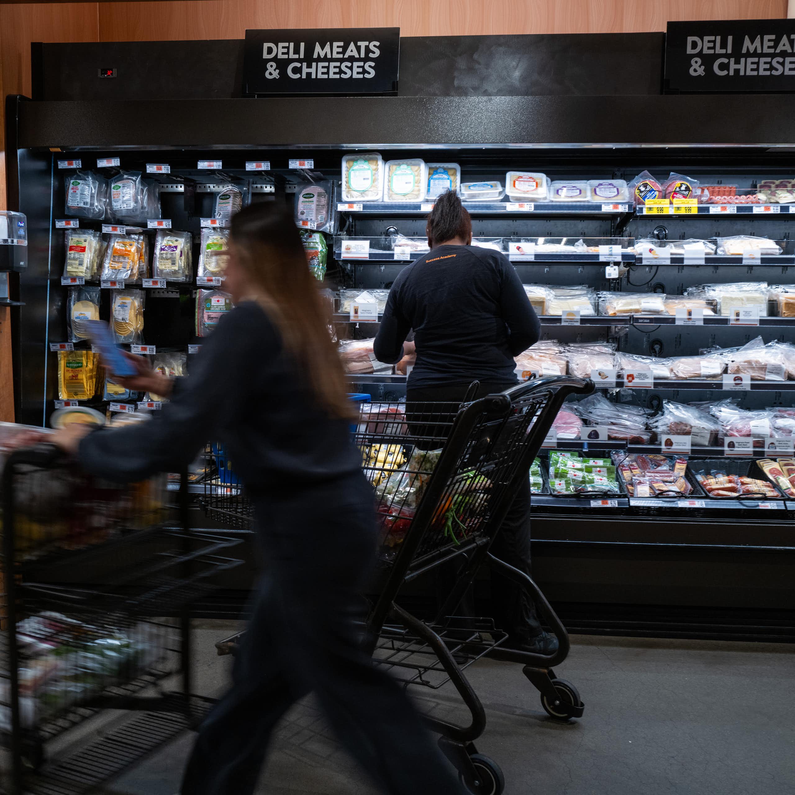 People shop at a grocery store.