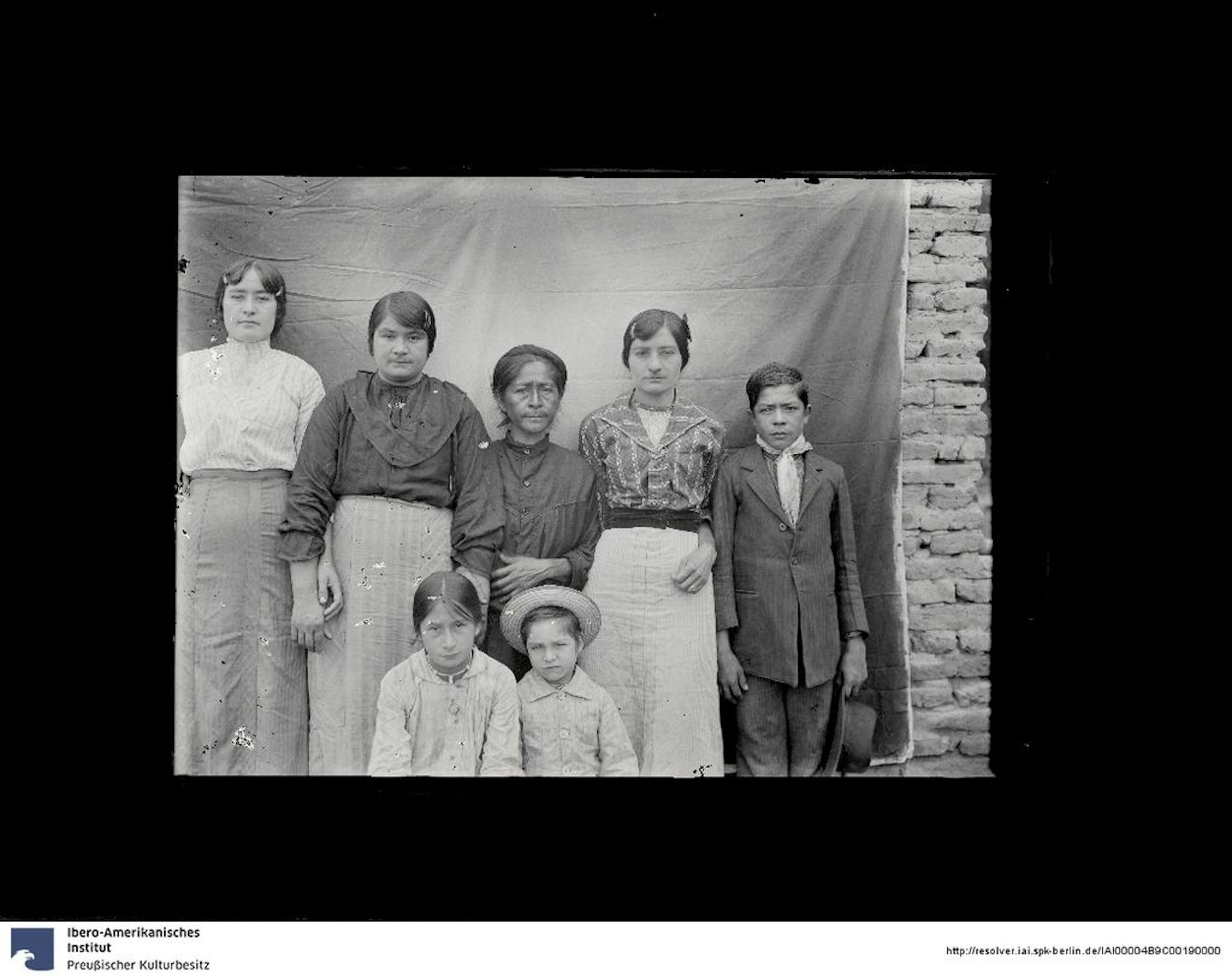 A black and white picture of some indigenous women.
