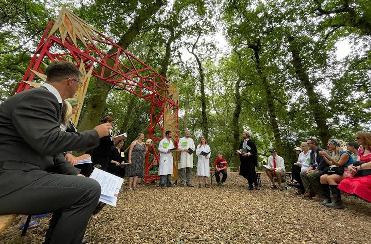 An imaginary court case is heard in woodland.