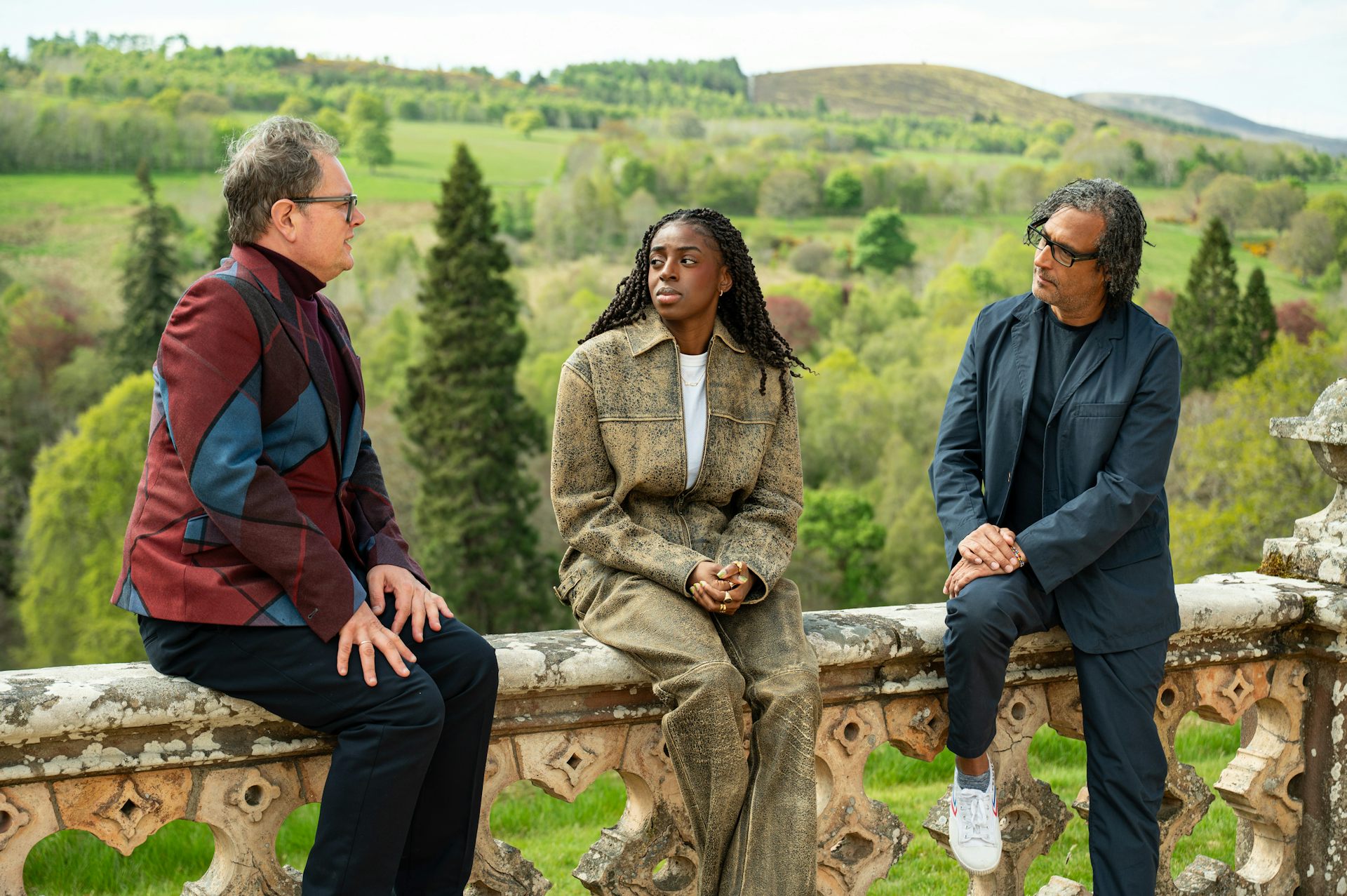 Alan Carr, Cat Burns and David Olusoga sat outside