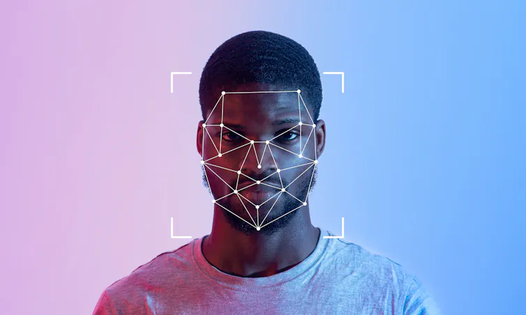 A person stands in front of a gradient background, featuring a facial recognition overlay.