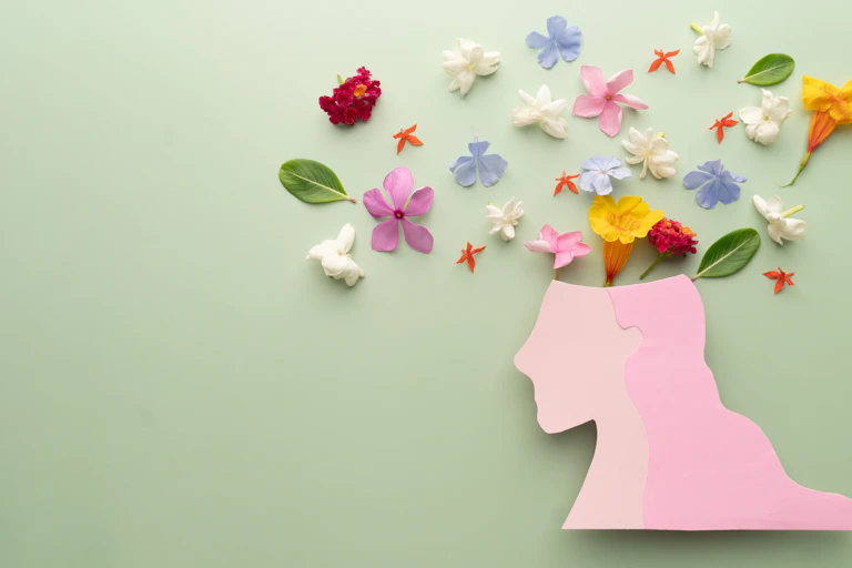 Flowers above stencil of a head