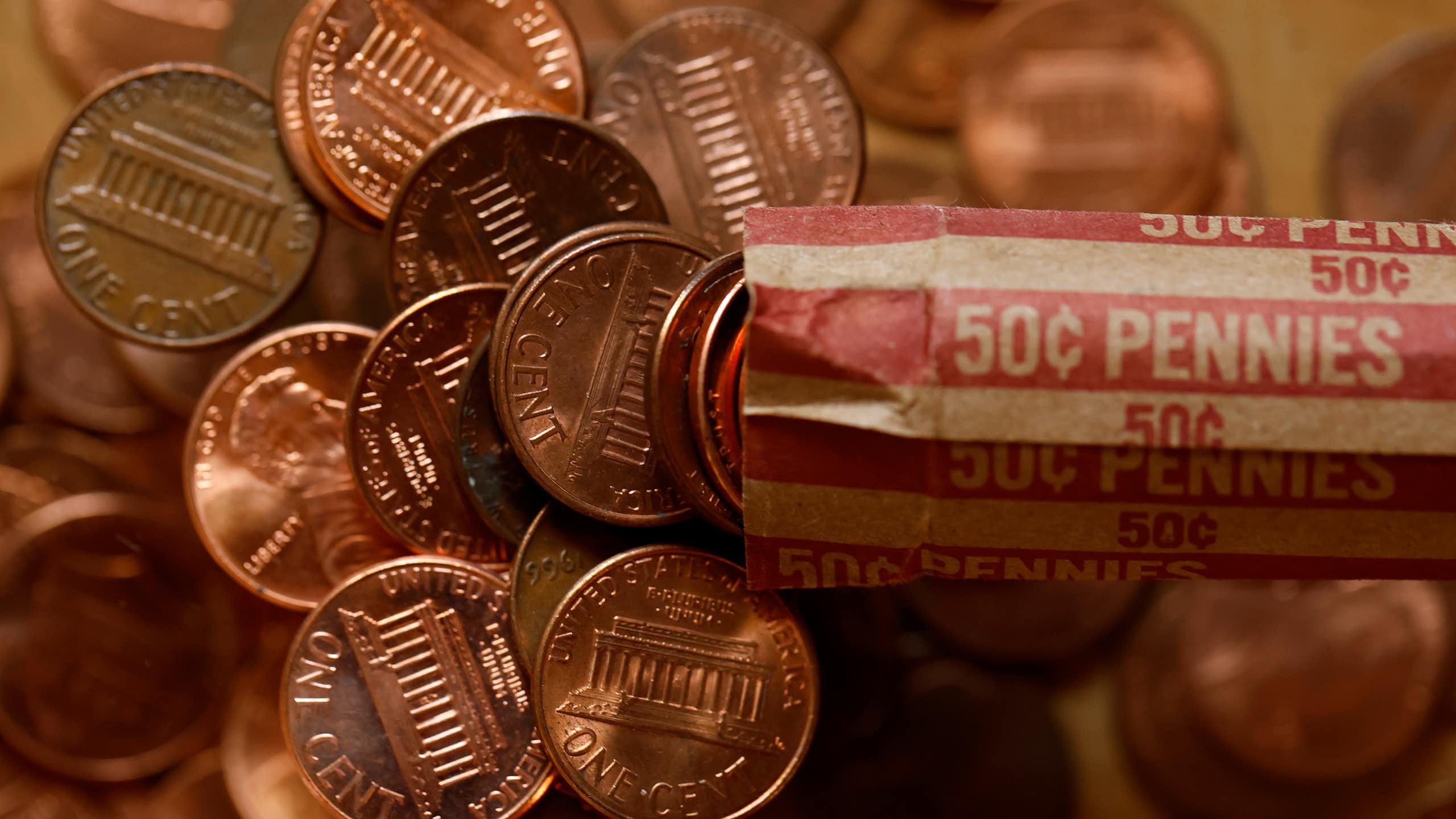 Light glints off a pile of pennies.