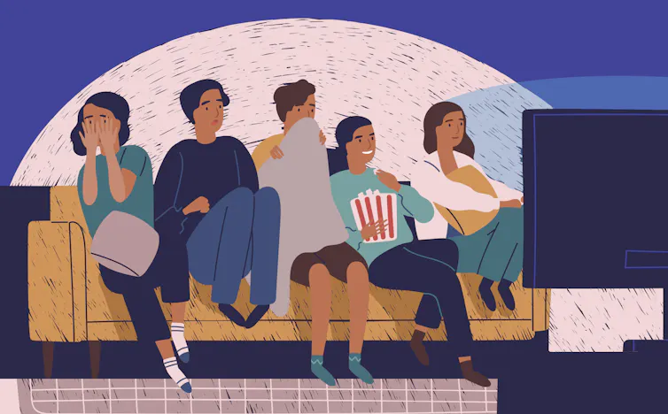Group of friends watching a film