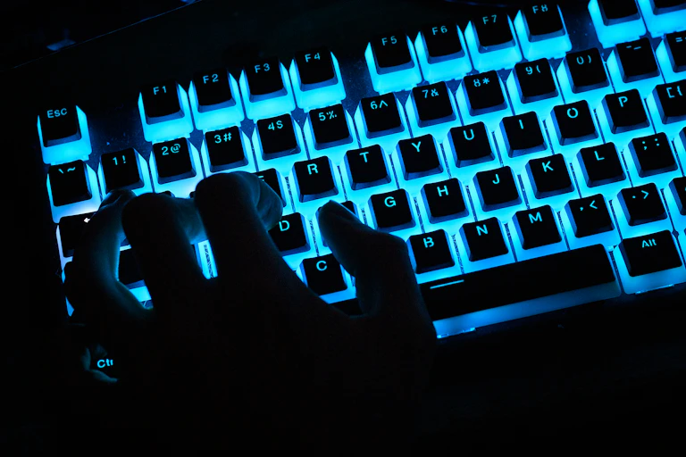 A close-up view of a customized illuminated computer keyboard being used at the epicLAN esport tournament on Oct. 12, 2019.
