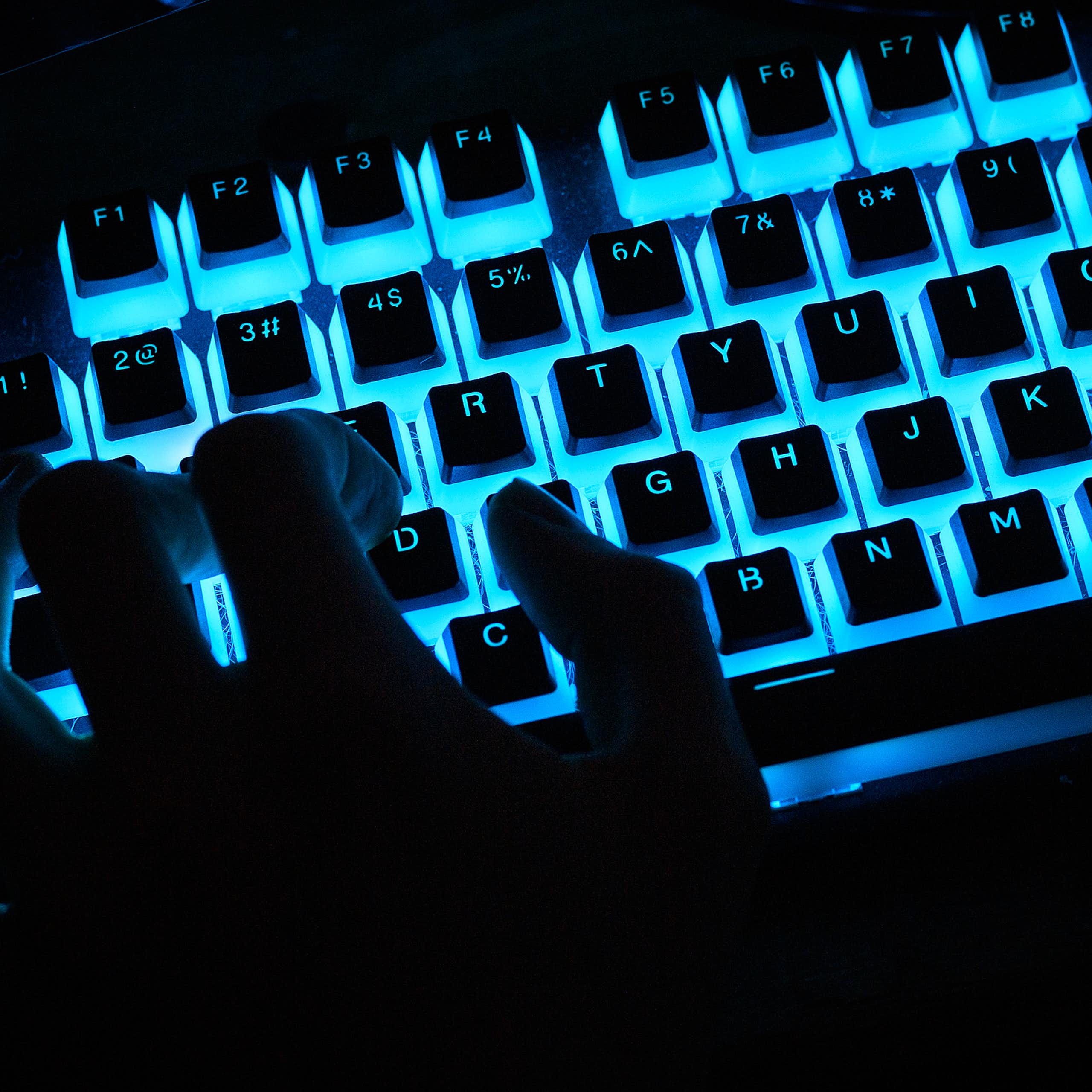 A close-up view of a customized illuminated computer keyboard being used at the epicLAN esport tournament on Oct. 12, 2019.