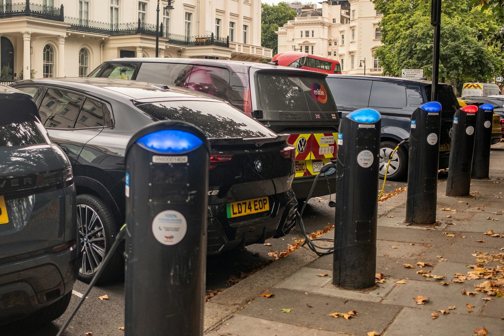 Electric cars being charged on a London street.