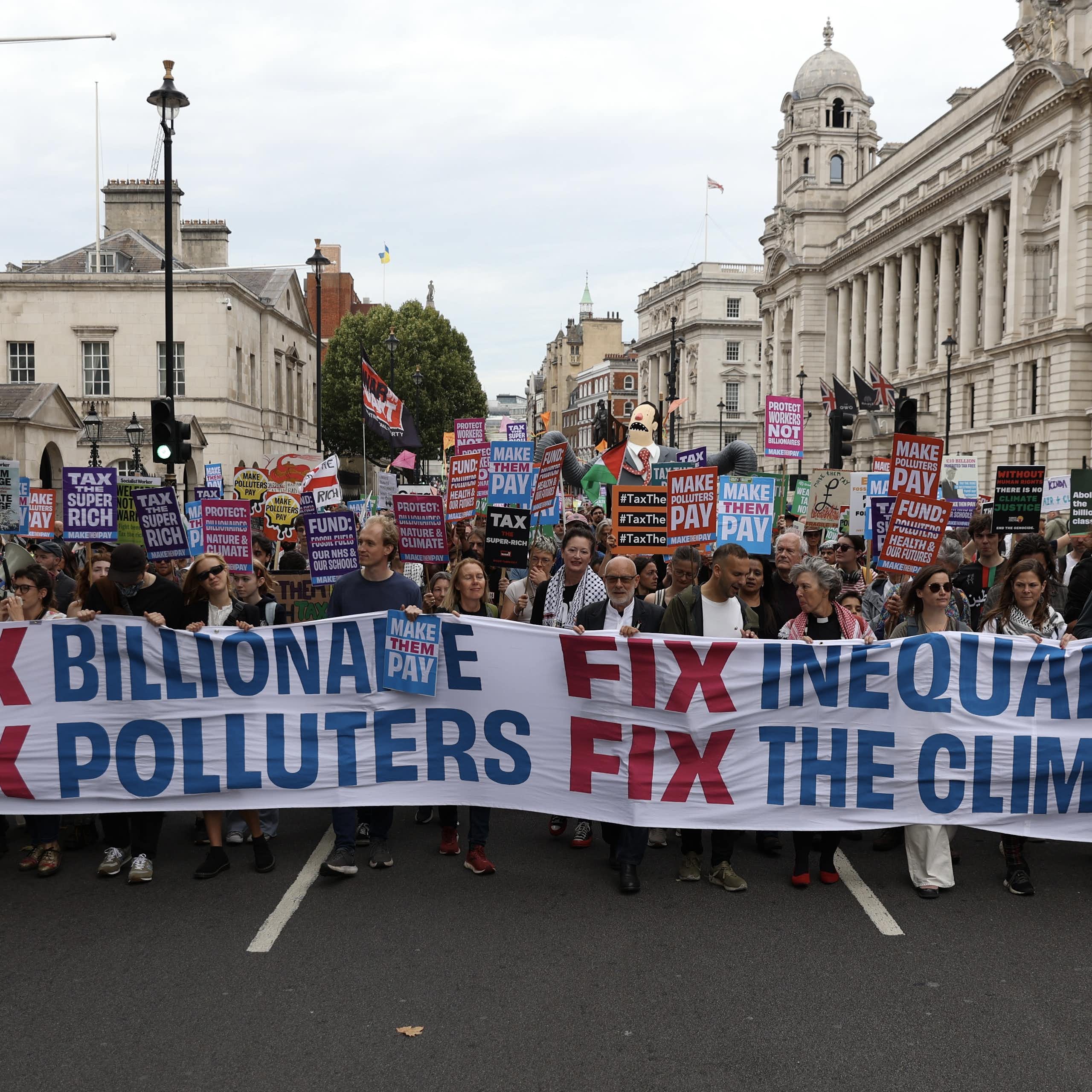 Demonstrators march with banners and placards during the "Make Them Pay" protest in London, United Kingdom on September 20, 2025.