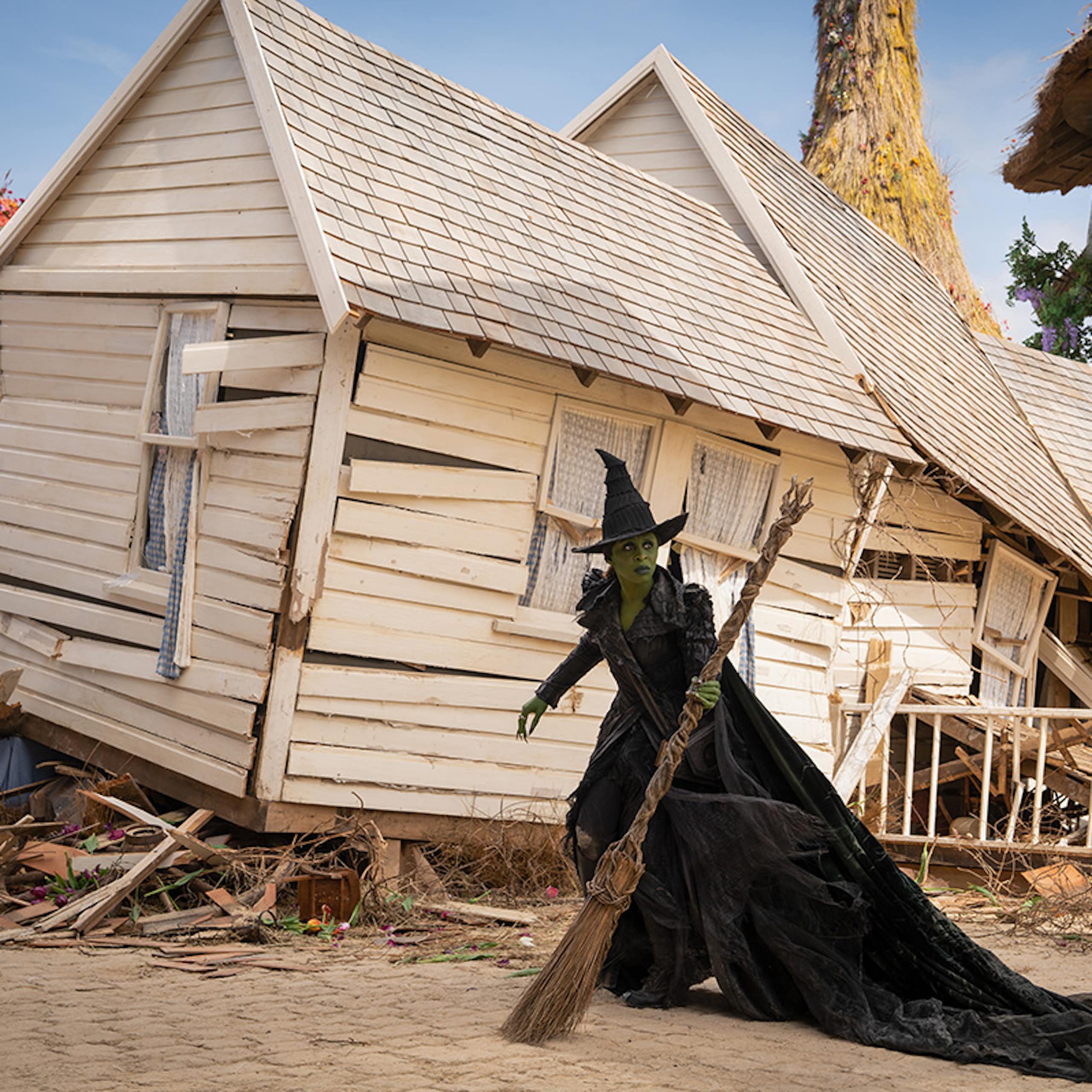 Elphaba in front of the house that brought Dorothy to Oz
