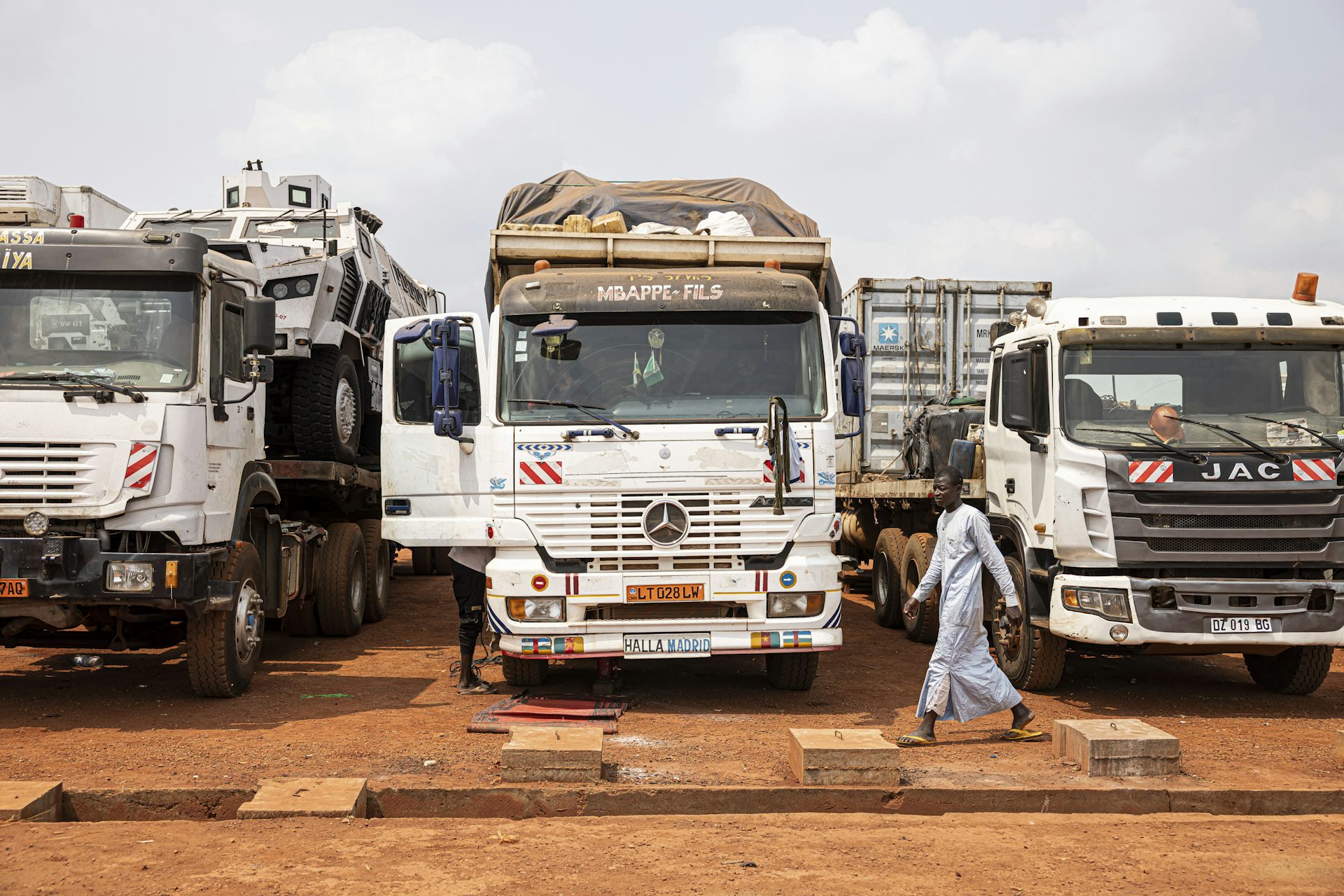 Three trucks parked beside each other 