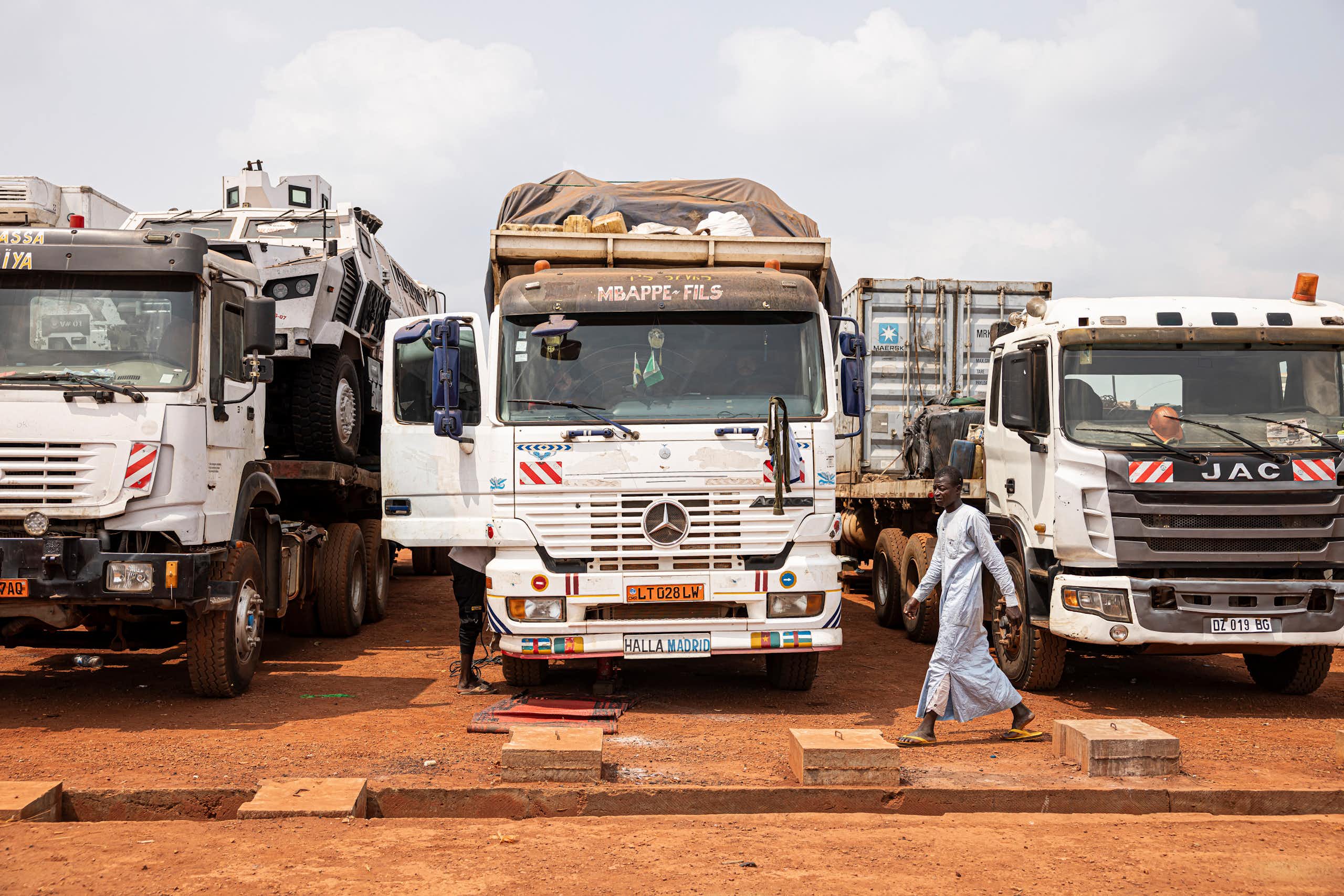 Three trucks parked beside each other