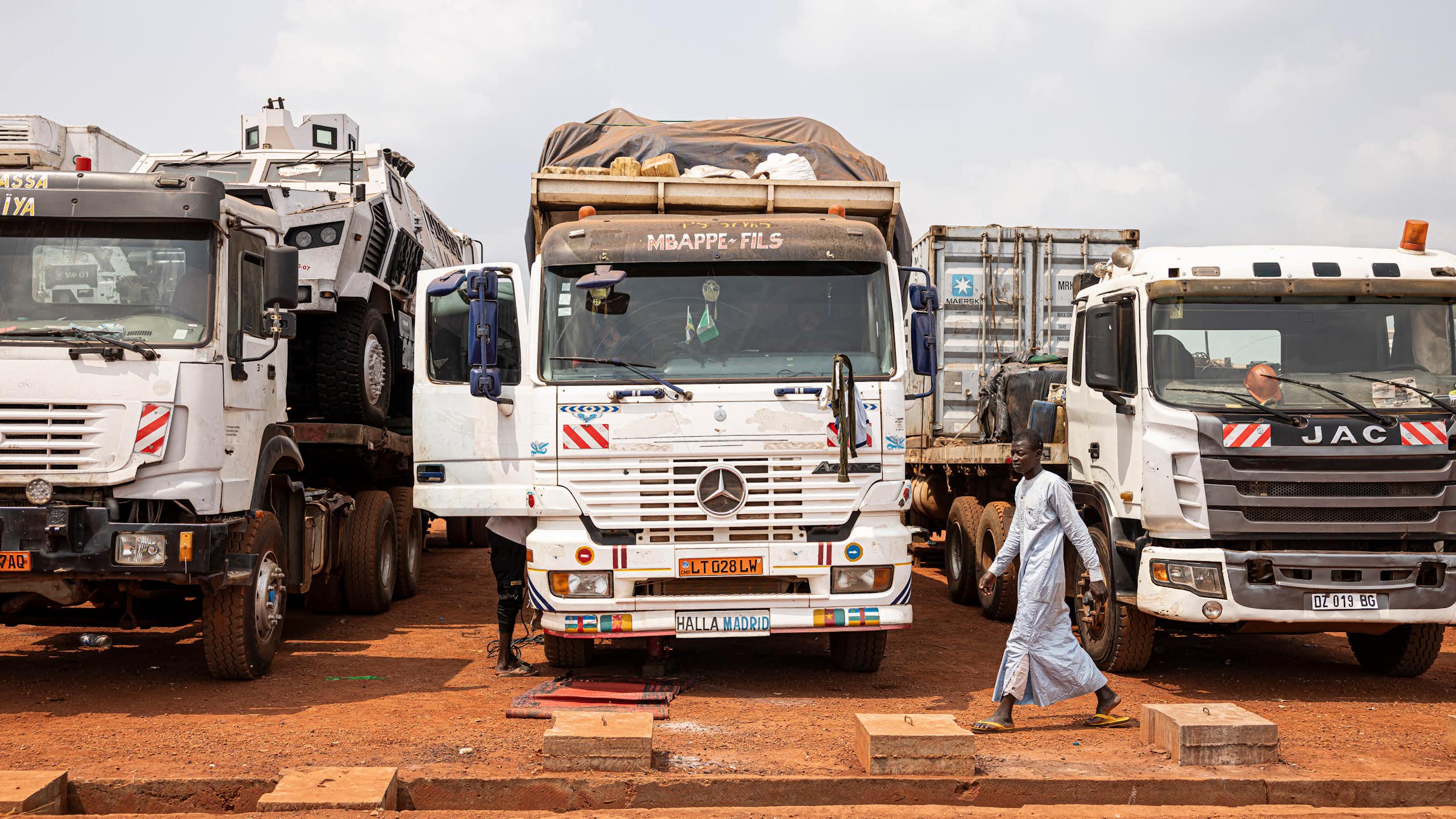 Three trucks parked beside each other