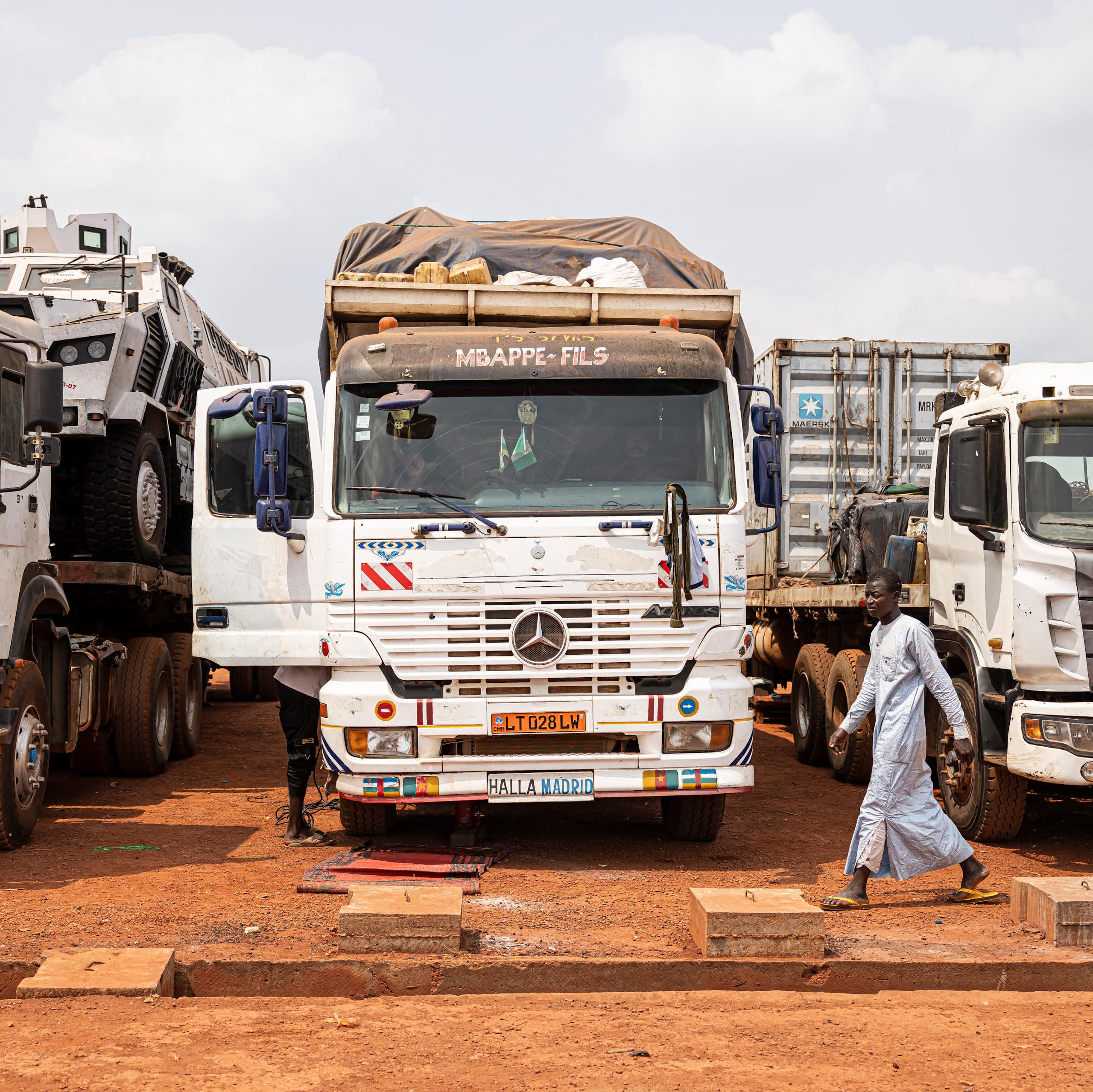 Three trucks parked beside each other