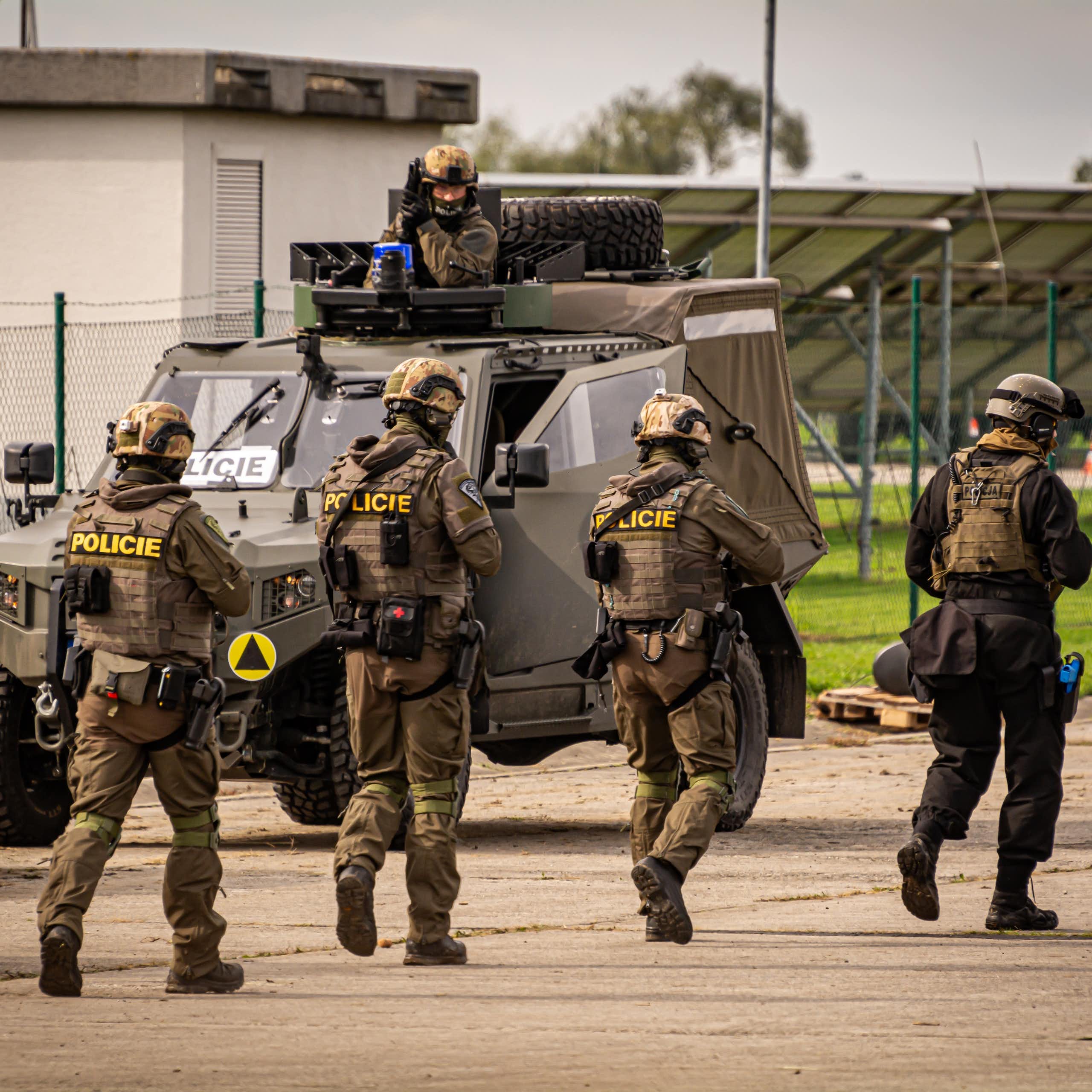 Team with army and police special forces rescue hostages in NATO wargames training.