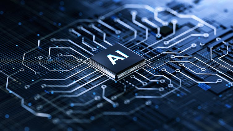 Computer chip marked 'AI' on circuit board.