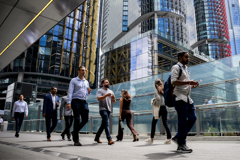 Office workers are seen walking outside in Sydney