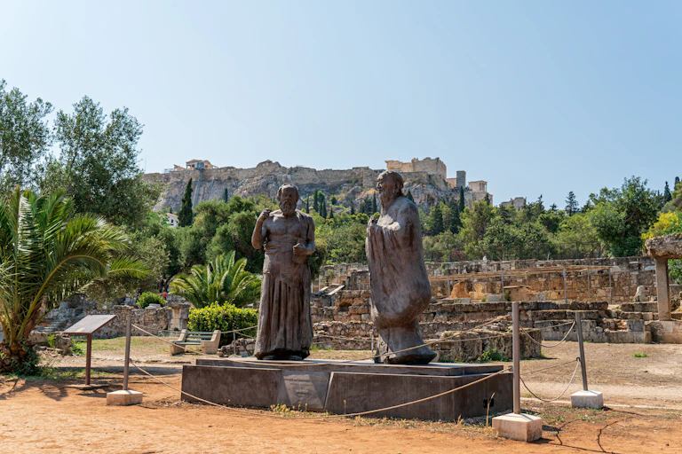 Two statues in ancient greek ruins in Athens