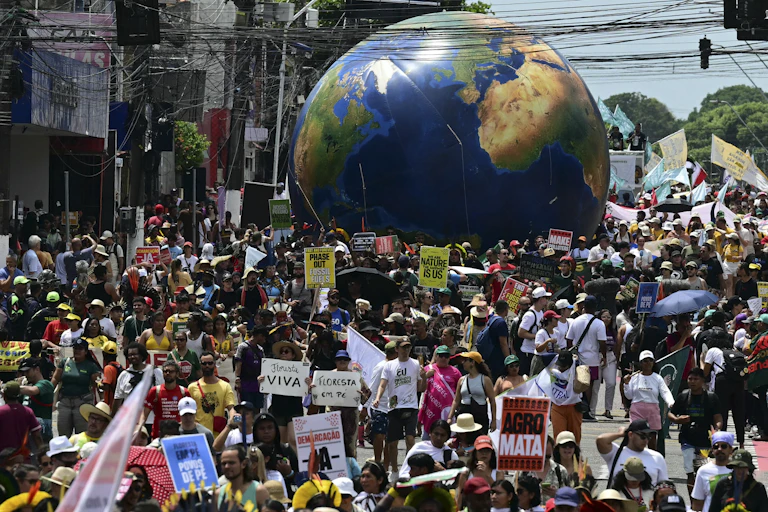 large demonstration in Brazil with a giant globe.
