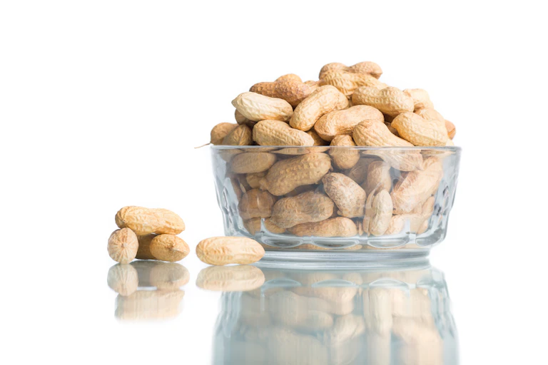 A bowl of whole peanuts.