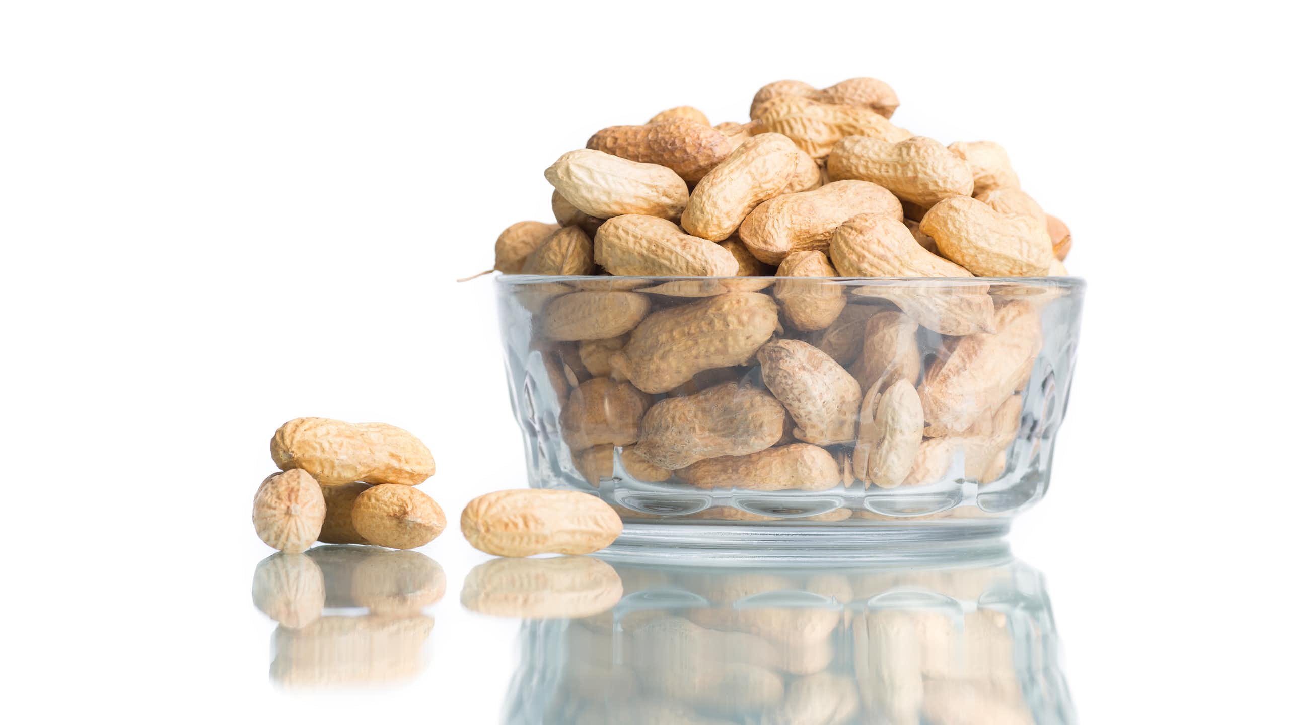 A bowl of whole peanuts.