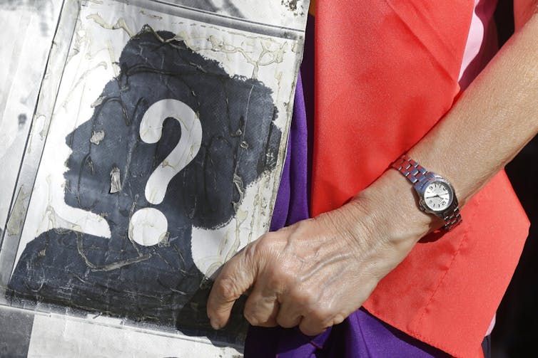 50 years after Franco’s loss of life, giving a voice to Spanish dictator’s imprisoned moms 1 Someone holds a sign for a missing person at a protest.