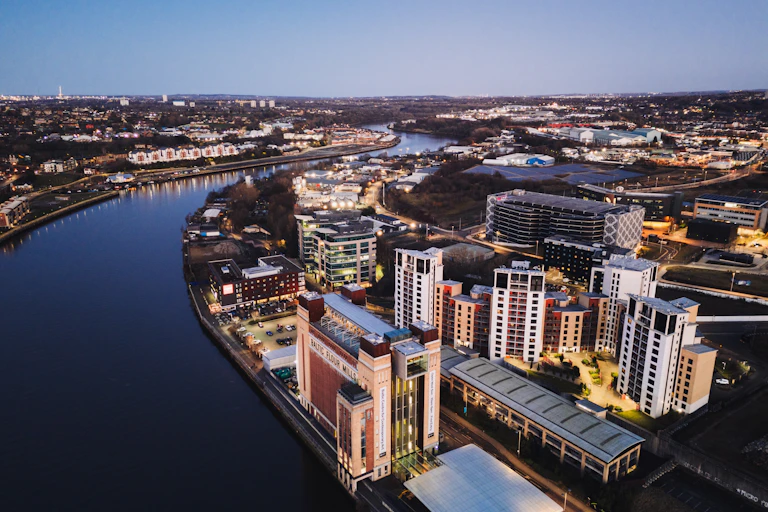 river running past Gateshead town, solar farm visible