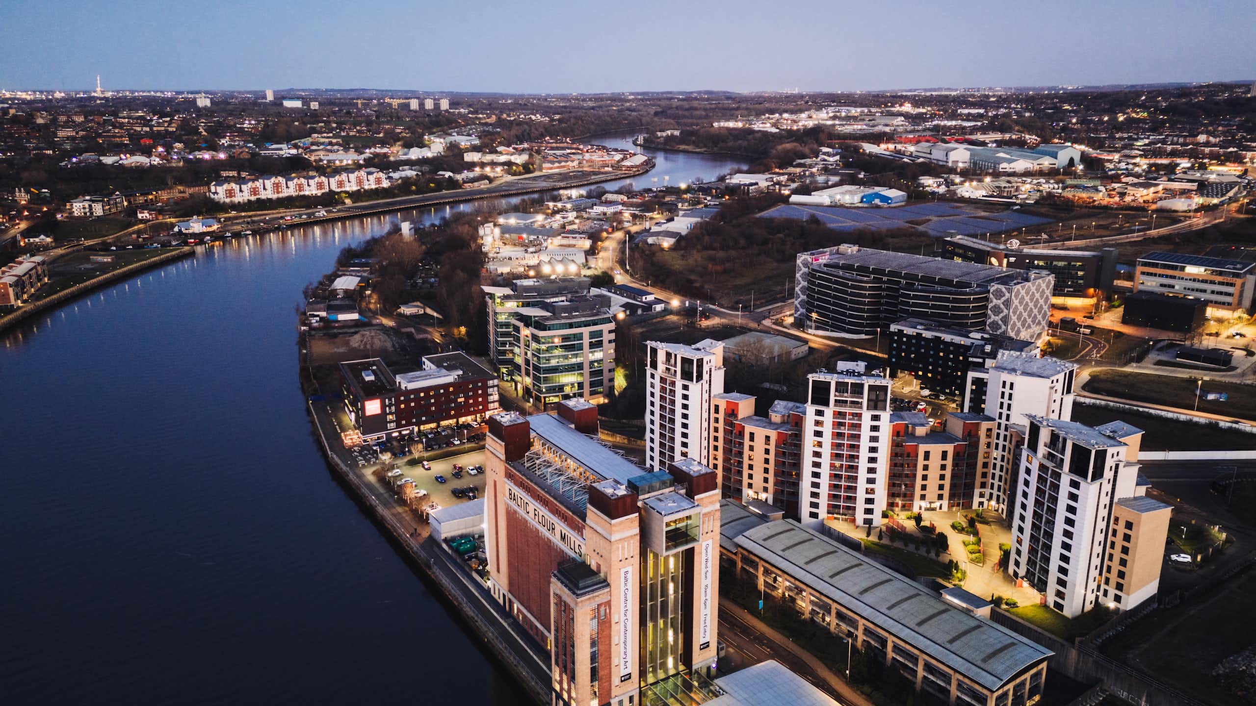 river running past Gateshead town, solar farm visible
