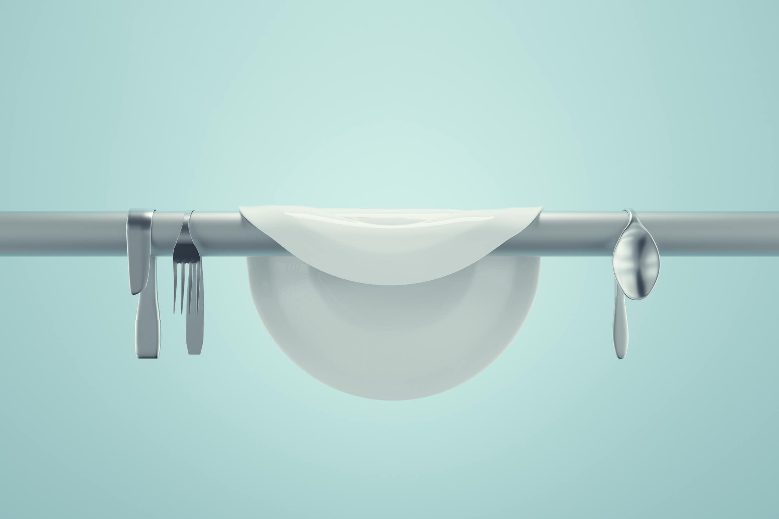 Image stylisée d'une assiette et de couverts suspendus au-dessus d'une barre