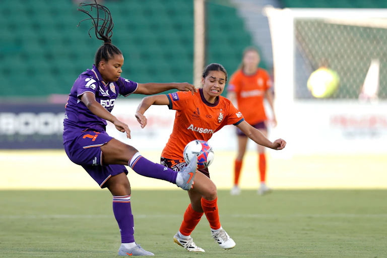 Naomi Thomas-Chinnama of the Glory clears the ball during an A-League Women’s match against the Brisbane Roar.