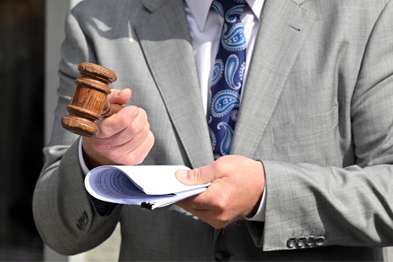 close up of a gavel held by an auctioneer