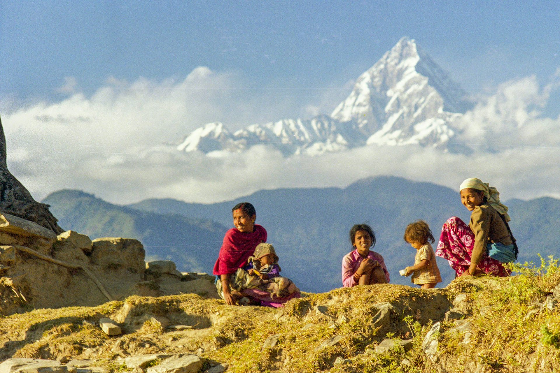 Four Nepali girls on a mountain ridge.
