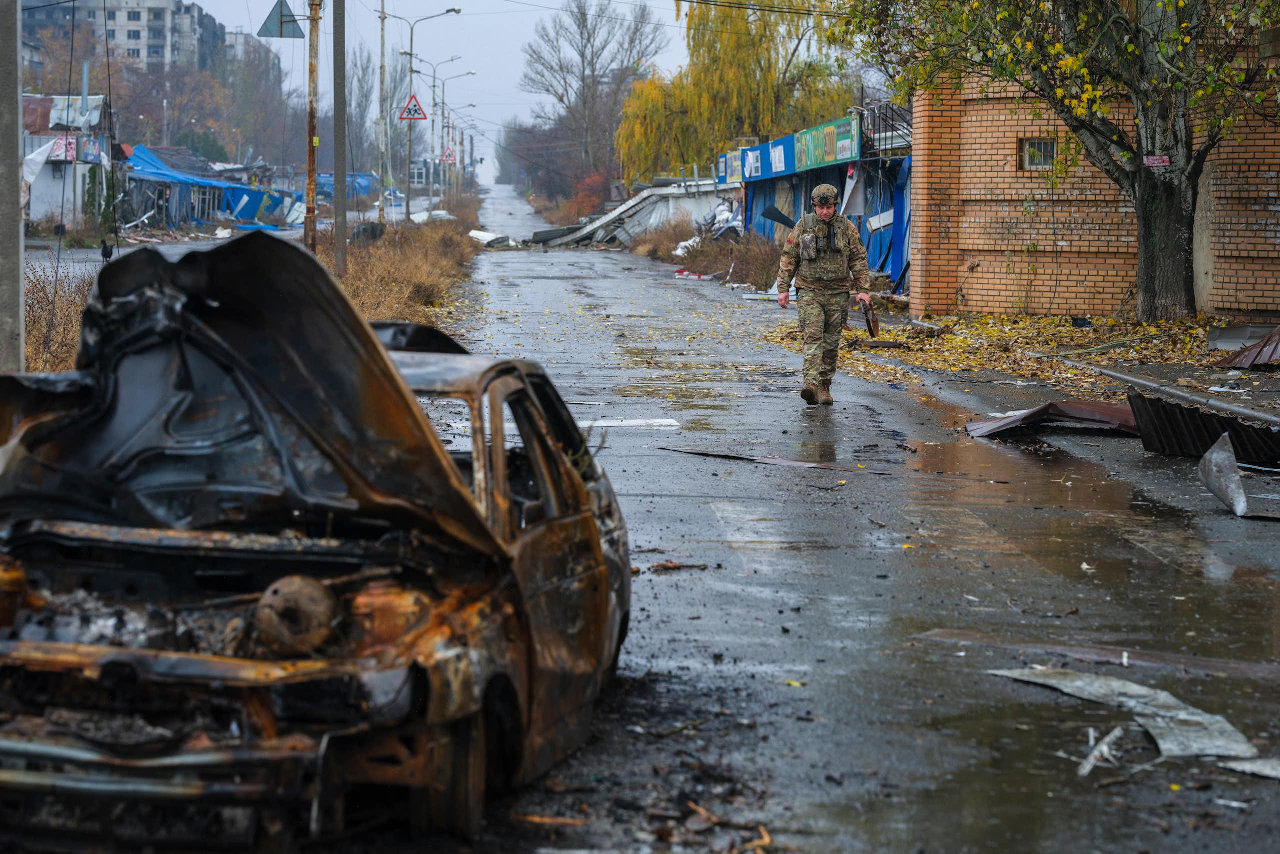 A Ukrainian serviceman walking in a damaged area of the frontline city of Kostyantynivka.