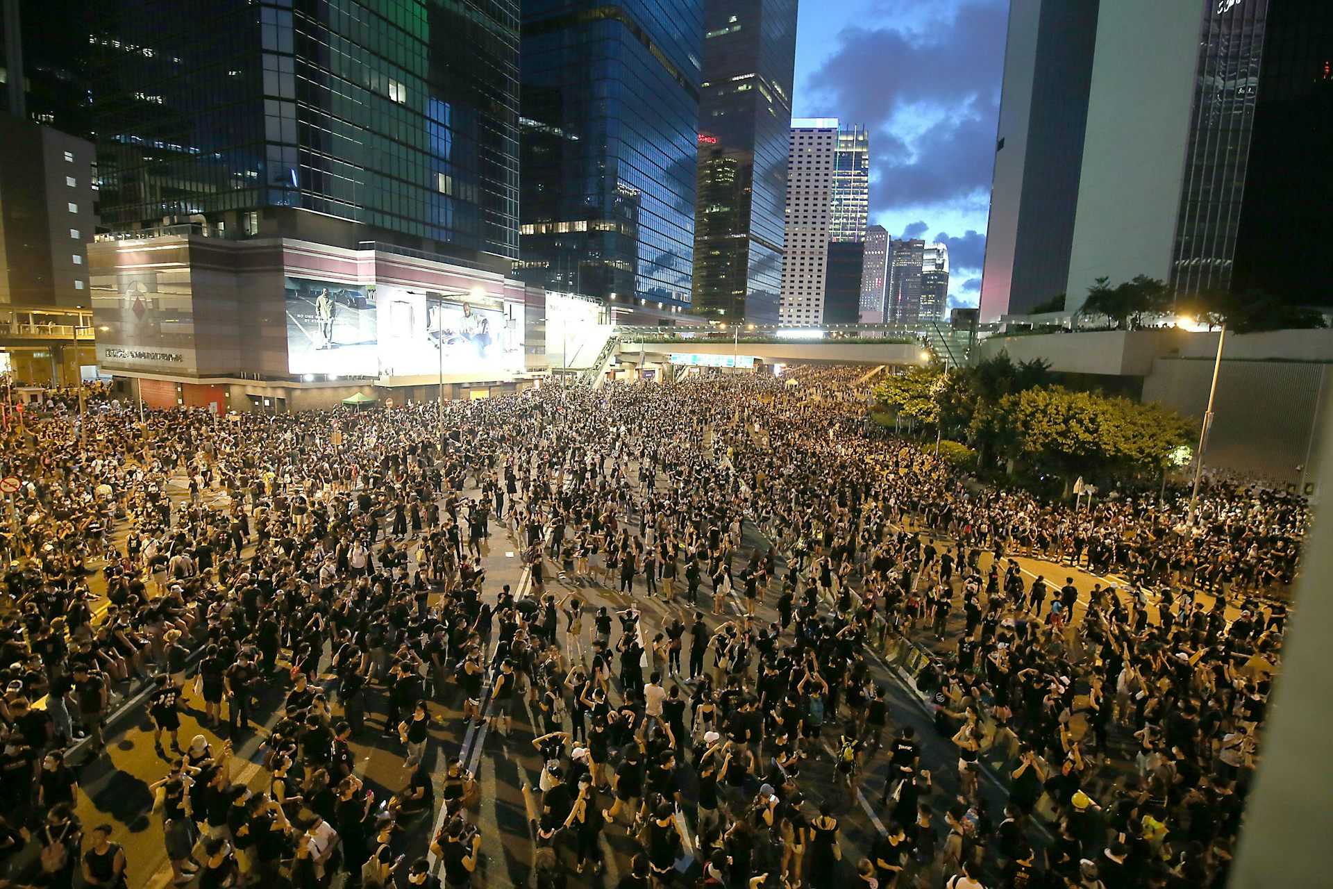 Crowds of people on roads in dark