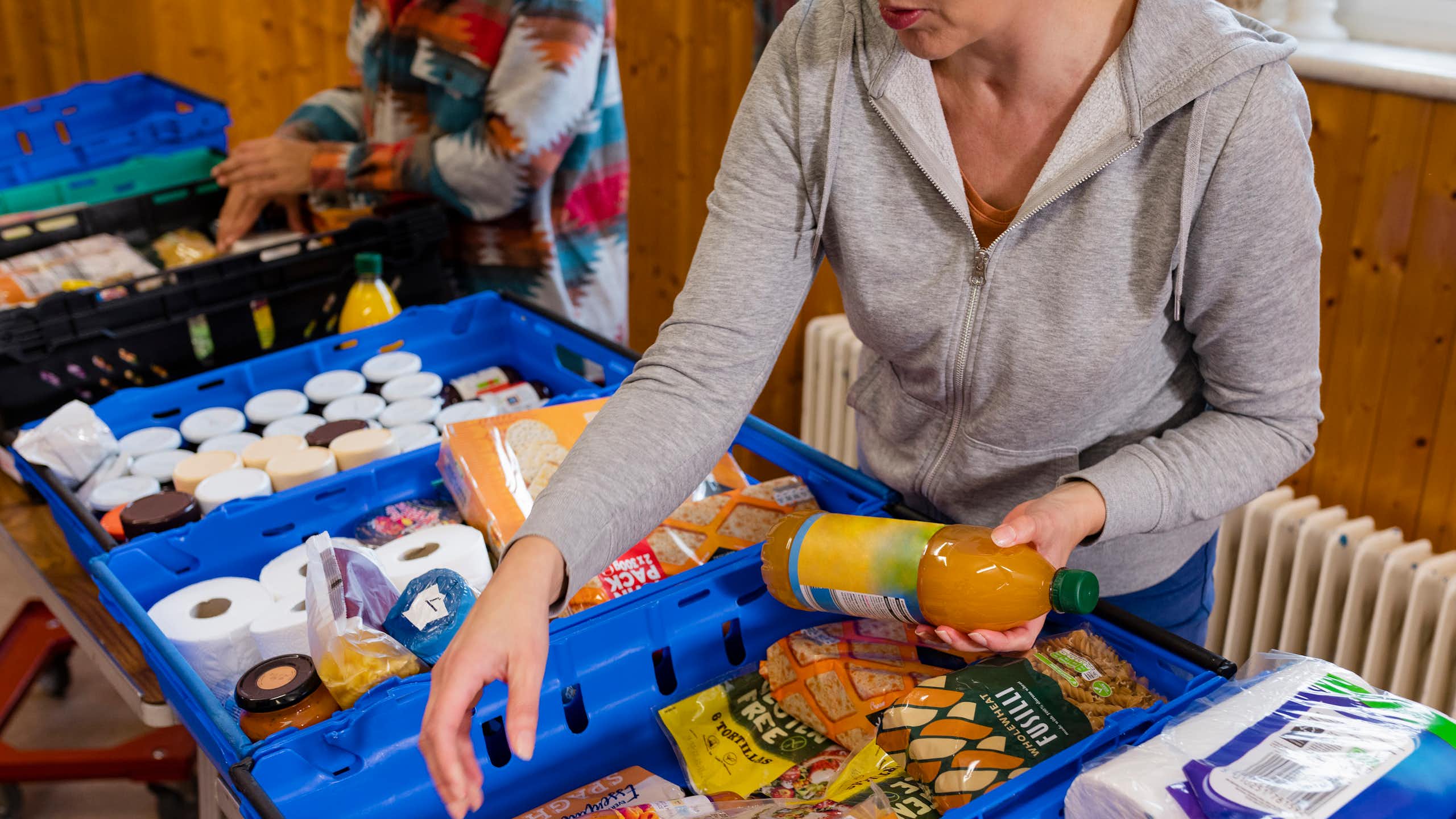 Women sort food at a food pantry.