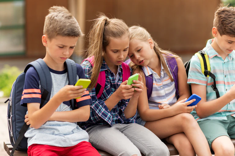 Children looking at smartphones