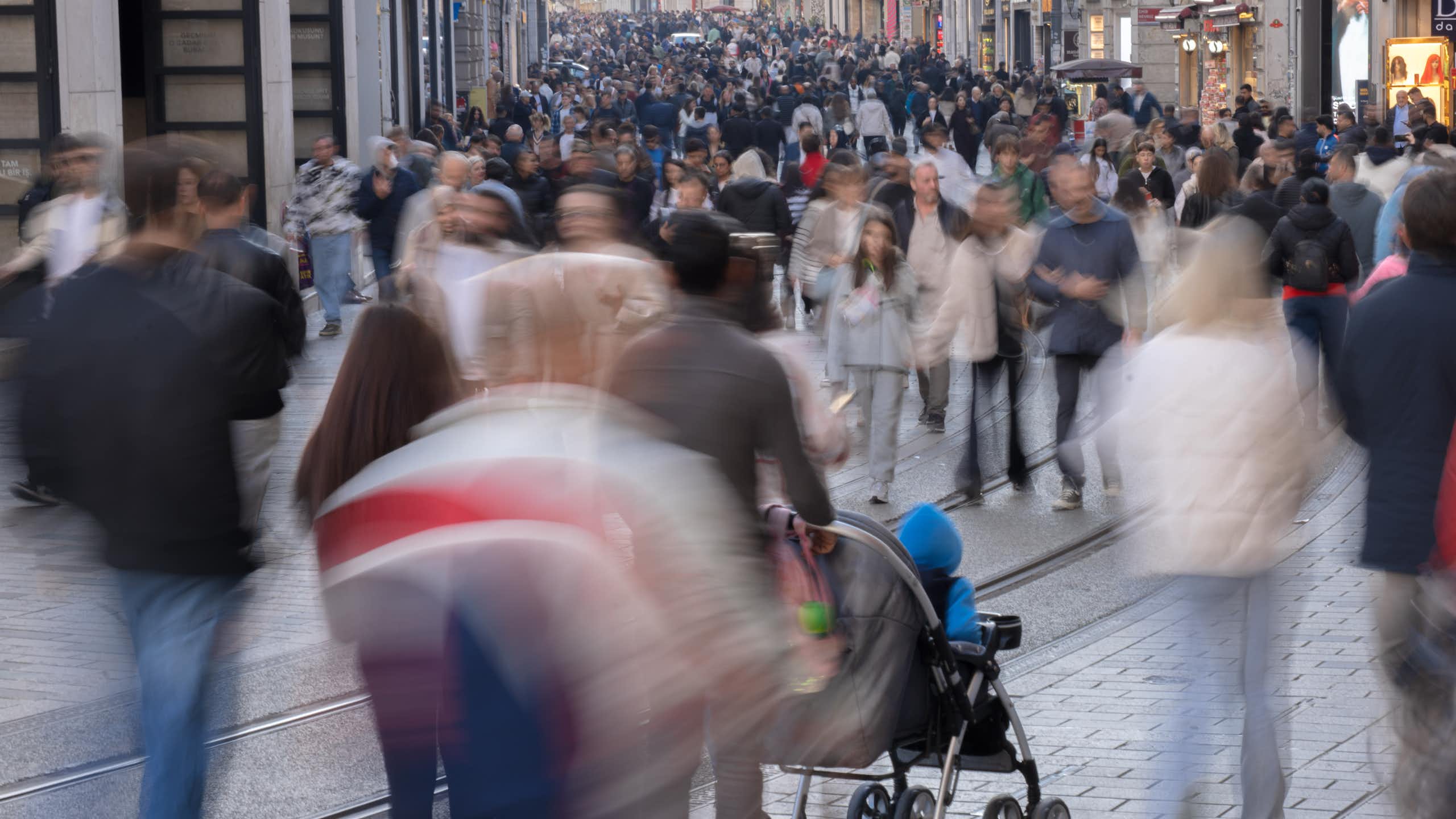 a crowded pedestrian street in a city