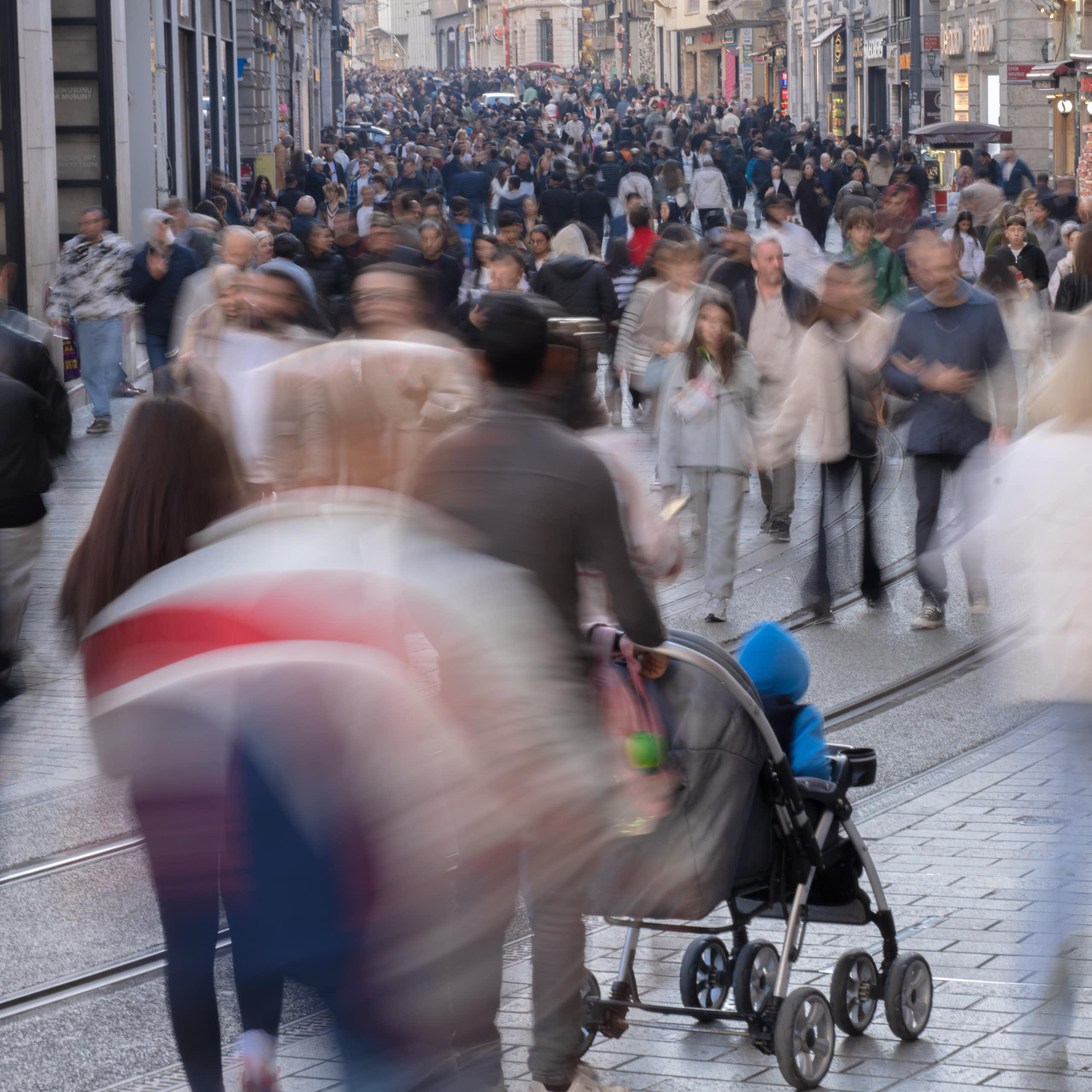 a crowded pedestrian street in a city