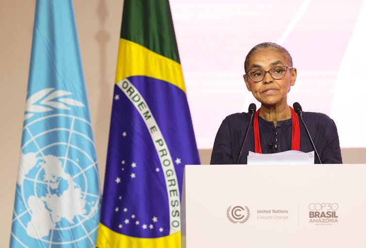 woman standing at podium.