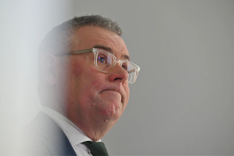 A close up picture of Environment Minister Murray Watt, looking a little glum.