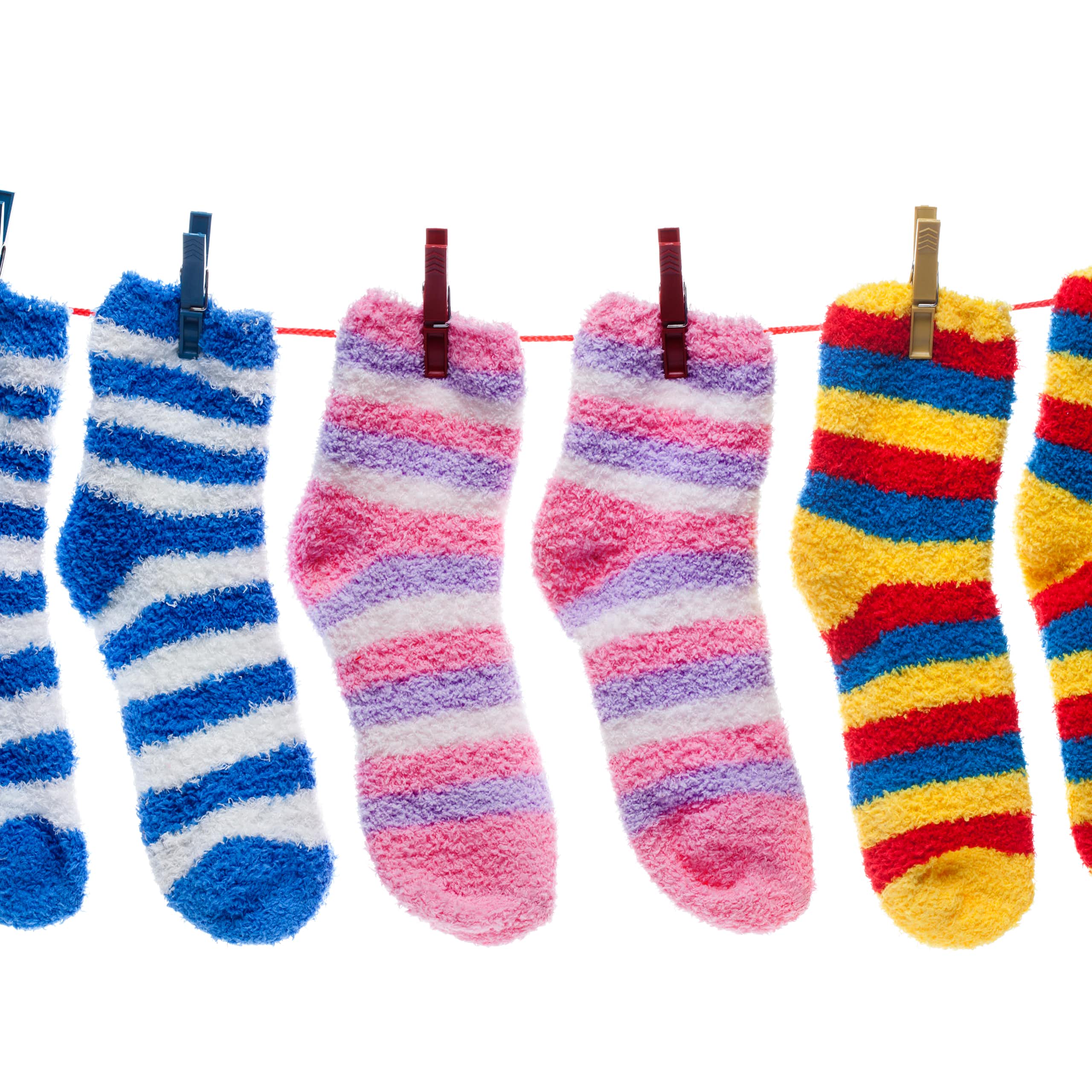 Striped fuzzy socks hanging on a clothes line