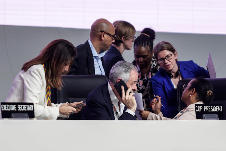 people huddle at conference