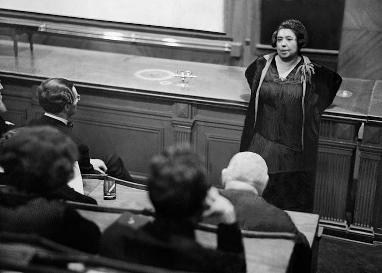 Stalin’s postwar terror centered Soviet Jews – within the identify of ‘anti-cosmopolitanism’ 3 A black-and-white photo of a woman standing in front of a lecture room.