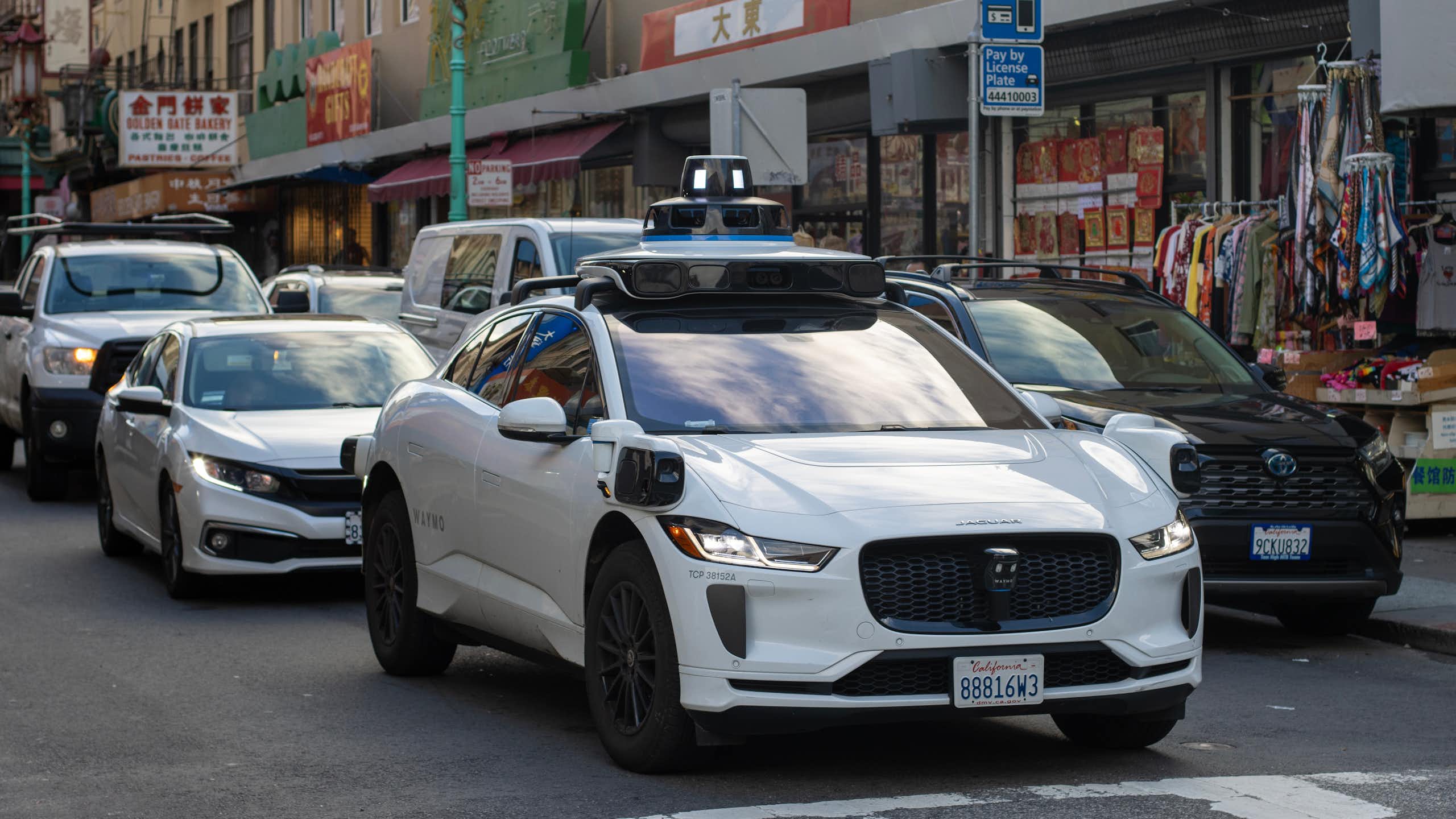 Driverless taxi in traffic.