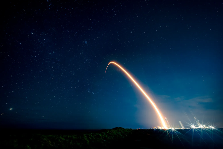 Decrease-cost house missions like NASA’s ESCAPADE are beginning to ship thrilling science – however at a value in menace and commerce‑offs 3 A bright light arching through a dark sky.