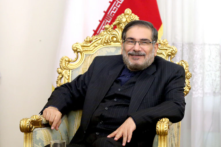 Top Iranian politician Ali Shamkhani sits on a golden throne.