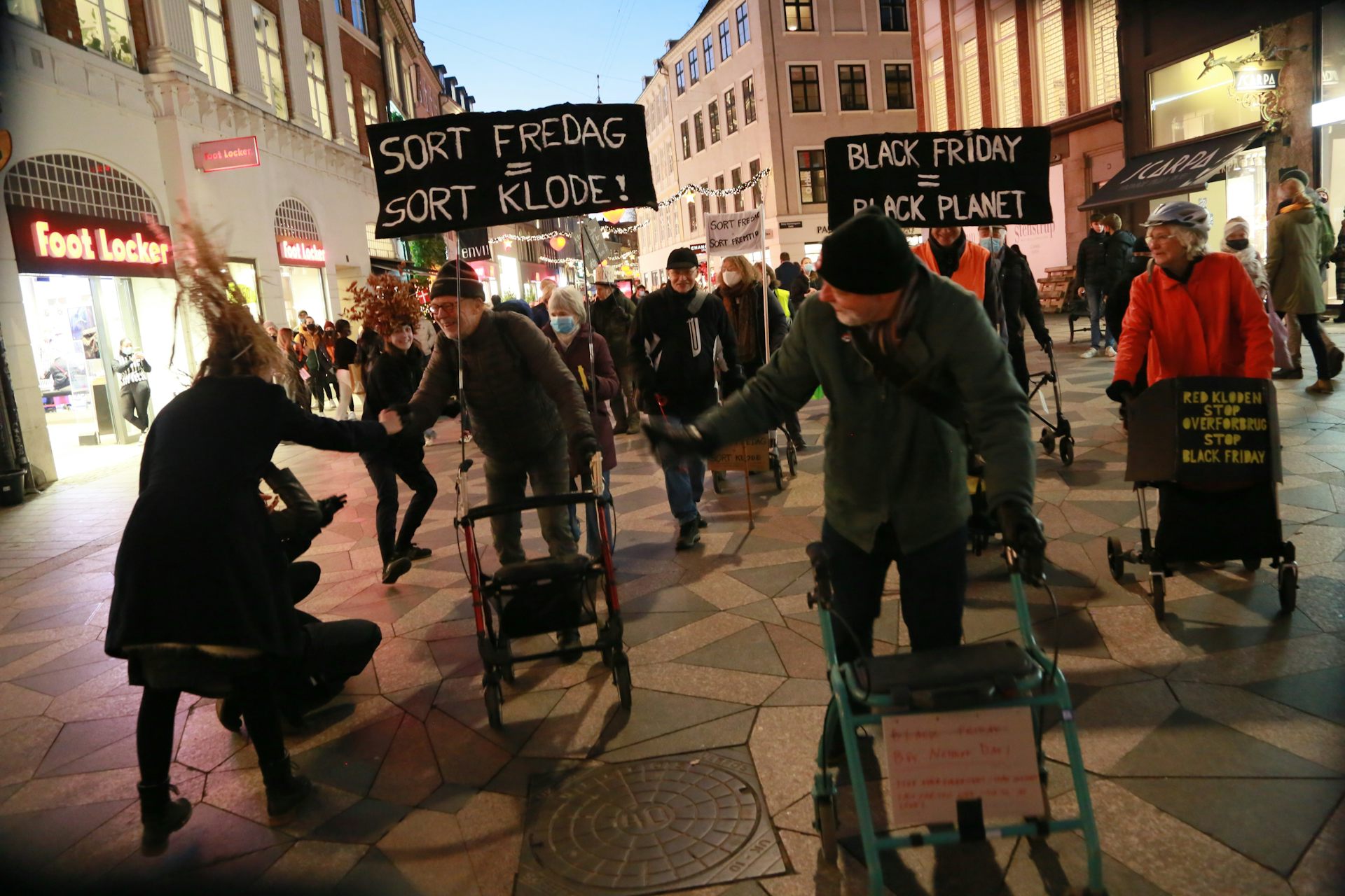 Performance artists on the streets of Copenhagen during Black Friday.