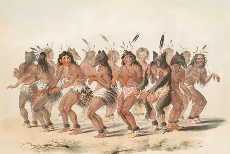 Des Amérindiens dansent en groupe