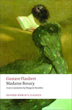 A woman reads a book on the cover of Madame Bovary
