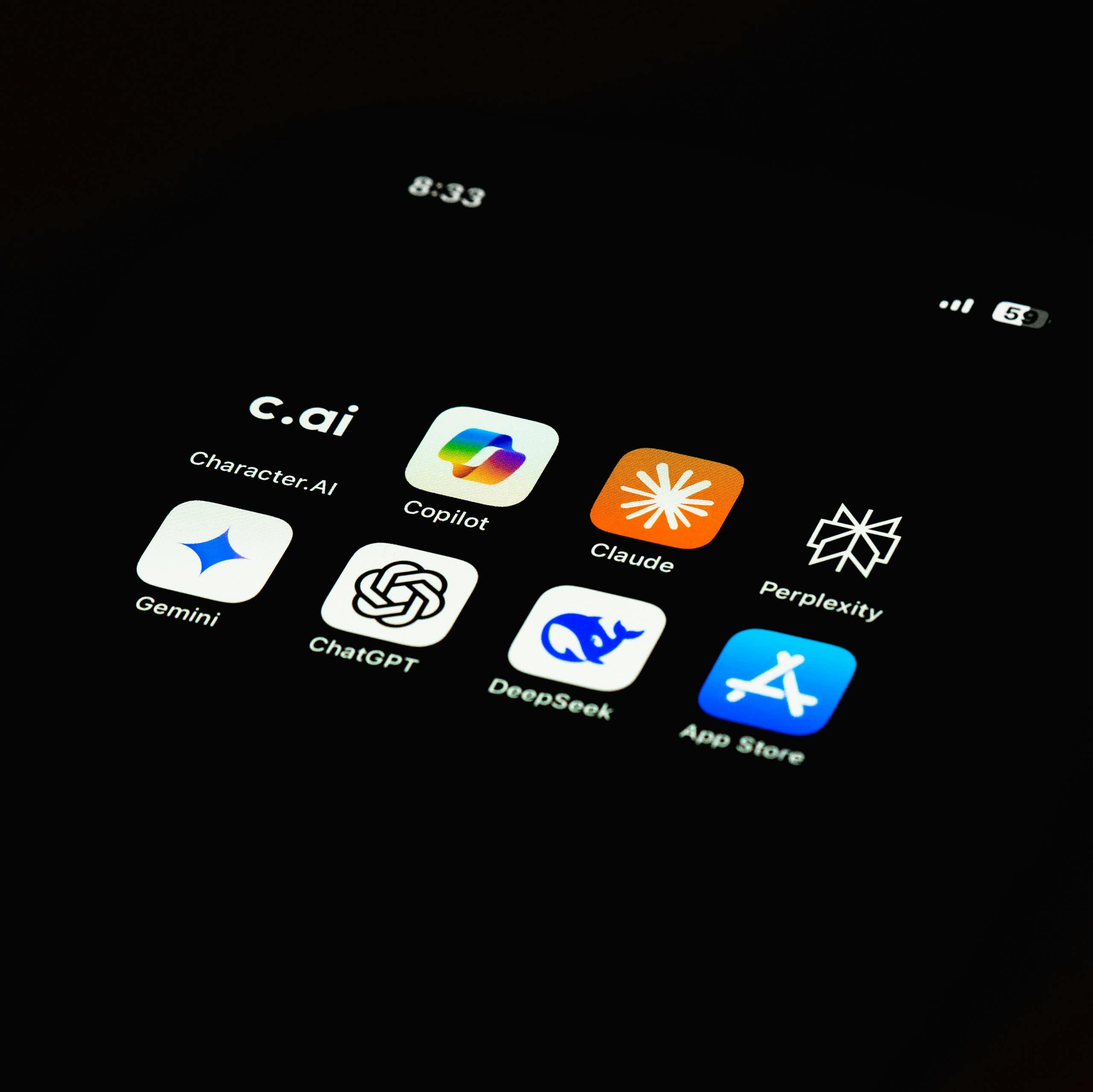 A dark phone screen displaying AI apps